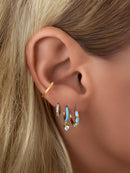 Blue CZ Sapphire Huggie Earrings by Emily Volaski